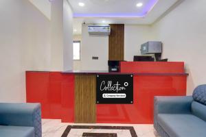 a waiting room with a counter and two chairs at Super Collection O MIDC Pimpari Pune Formerly SK Palace in Chinchwad
