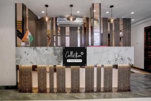 a lobby with a counter with a sign on it at Collection O Crawford Market Formerly Al Ibrahim Hotel in Mumbai