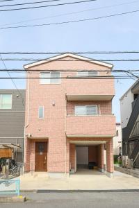 a red brick building with a garage at 天空山 in Kawagoe