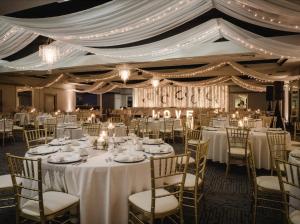 a banquet hall with white tables and chairs at Quality Inn & Conference Centre Kingston Central in Kingston +47 photos