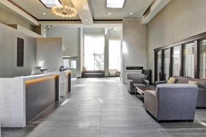 an office lobby with a reception desk and chairs at Radisson Hotel & Conference Centre Edmonton in Edmonton