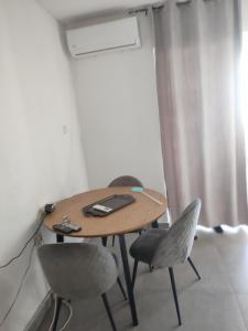 a table and two chairs in a room at Dinos Apartments in Ulcinj