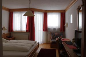 En eller flere senger på et rom på Hotel Camona & Apart Walserhof