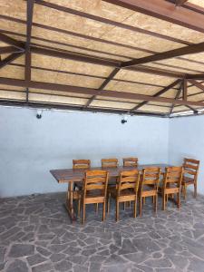 a wooden table and chairs in a room at Dilijan Rest - Comfortable rooms & Pool in Dilijan
