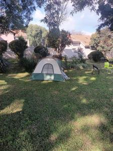 a tent sitting in the grass in a yard at Fourways guesthouse & spa in Fourways
