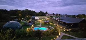 an aerial view of a camping site with tents and lights at Kopuła glampingowa Boho in Krzesimów