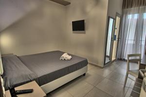 Postel nebo postele na pokoji v ubytování GFH - Hotel Sole Resort & Spa