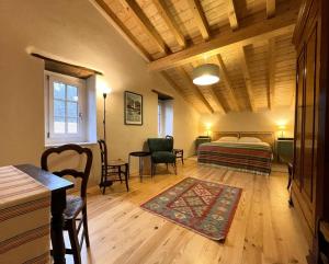 a bedroom with a bed and a table and chairs at Artekoborda in Souraïde +43 photos