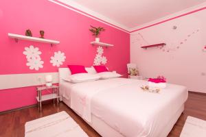 Posteľ alebo postele v izbe v ubytovaní Apartmani MM