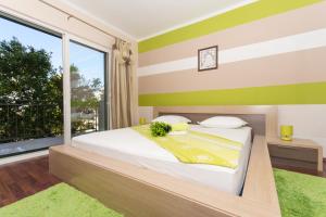 Posteľ alebo postele v izbe v ubytovaní Apartmani MM