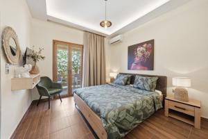 a bedroom with a bed and a desk and a chair at Villa Astron in Agios Georgios