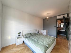 a bedroom with a large bed and a mirror at Villa Nella in Tinjan +27 photos