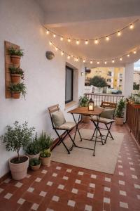 a patio with a table and chairs and lights at CASA DEL MAR-Costa Daurada in Cunit +44 photos