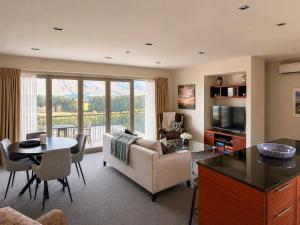 a living room with a couch and a table at Best high country retreat - Terrace Downs in Windwhistle