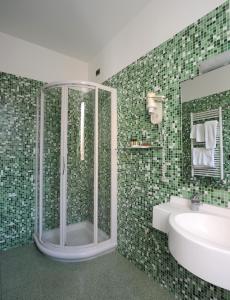 a bathroom with a shower and a sink at Panorama Hotel in Siracusa