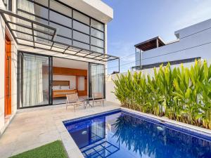an image of a house with a swimming pool at Villa Exquisite Central Seminyak by Nagisa Bali in Seminyak