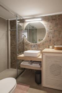 a bathroom with a sink and a mirror at Panagea Holiday in Kitriaí +40 photos