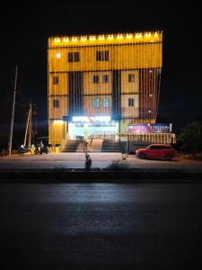 a building with lights on top of it at night at Hotel N Pride in Guntūr