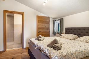 a bedroom with a bed with two pillows on it at Ferienwohnung Grubgut in Taxenbach