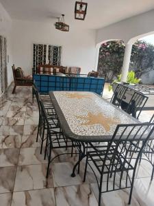 a table and chairs sitting on a patio at Villa Ross in Saly Portudal