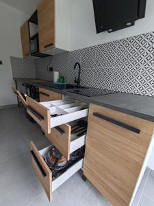 a kitchen with a sink and a counter top at Apartamenty DK8 in Szalejów Górny