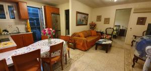 a living room with a couch and a table at Margarita's house in Sami
