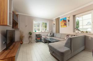 a living room with a couch and a table at Stadt-Chalet Schladming in Schladming