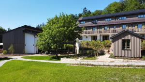 a large building with a lawn in front of it at WALDGUT Naturresort in Bad Gottleuba