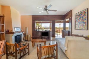 a living room with a couch and a fireplace at Villa las Terrenas in Calafell