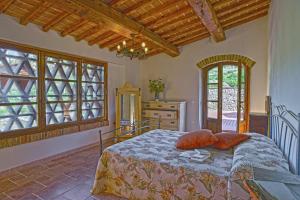 A bed or beds in a room at Agriturismo Val di Sterza