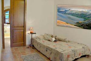 A bed or beds in a room at Agriturismo Val di Sterza