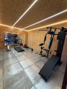 a gym with several treadmills and machines in a room at Complejo Rural Los Veleros in Ontur