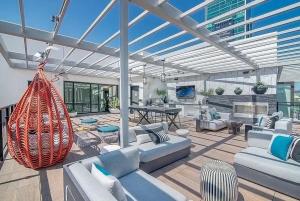 a living room with couches and a patio at Wallace Luxurious in Los Angeles