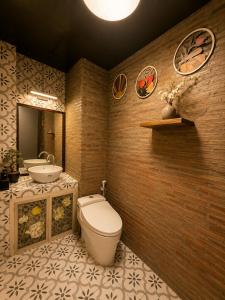 a bathroom with a toilet and a sink at Spring Home 2 in Can Tho +32 photos