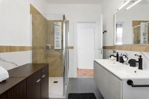 a bathroom with a sink and a shower at Villa Giusy in Verdellino +24 photos