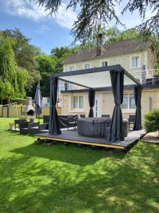 a gazebo in the yard of a house at Le Chêne Pommier Proche Honfleur in Fatouville-Grestain