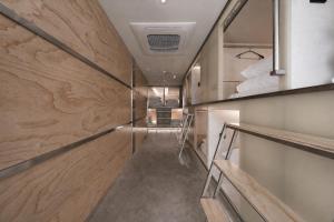 a hallway with wood paneling and a staircase at At gangnam seoul in Seoul