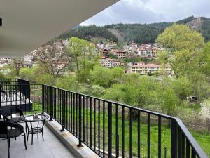 a balcony with a view of a city at Guest House ELIYA in Devin