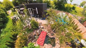 an overhead view of a garden with a shed at Garden Residence - The Lotus in Drahobudice