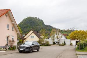 a car parked on a street in a residential neighborhood at Premium Ferienwohnung Dörr in Singen