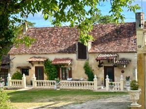 a house with a fence in front of it at Chateau De La Ricardie, Gite La Ricardie, Beautiful Rural Property Gite Villa in Liorac