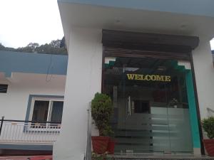 a welcome sign on the door of a building at Tapovan ganga view in Uttarkāshi