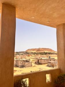 a view of a desert from a window of a building at deluxe experience siwa in Siwa