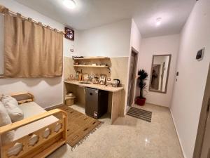 a small room with a bed and a desk in it at deluxe experience siwa in Siwa