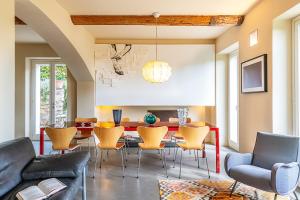 a dining room with a table and chairs at Villa Rosmarino in Camogli