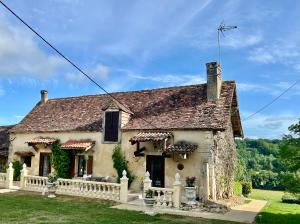 a stone house with a fence in front of it at Chateau De La Ricardie, Gite La Ricardie, Beautiful Rural Property Gite Villa in Liorac