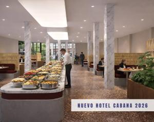 a buffet line with food on it in a lobby at Hotel Cabana in Benidorm