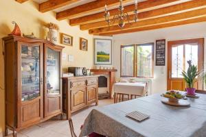 a kitchen with a table and a dining room at Chambres D'hôtes 4 Saisons in Villefranche-Sur-Cher +43 photos