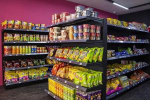 a store filled with shelves filled with lots of food at Apex by Bukit Bintang Hotel in Kuala Lumpur