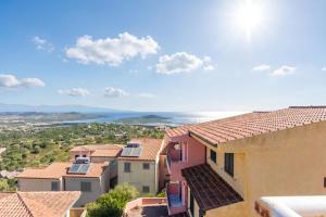a view of the ocean from a building at Elicriso - Happy Rentals in San Pasquale +15 photos